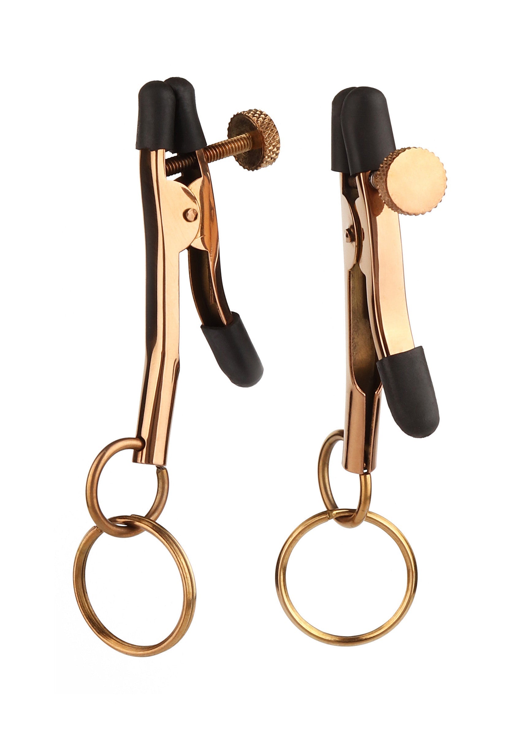 Pinces à tétons dorées réglables avec anneaux. Pour une expérience sensuelle et excitante.; Verstelbare gouden tepelklemmen met ringen. Voor een sensuele en opwindende ervaring.; Adjustable golden nipple clamps with rings. For a sensual and exciting experience.