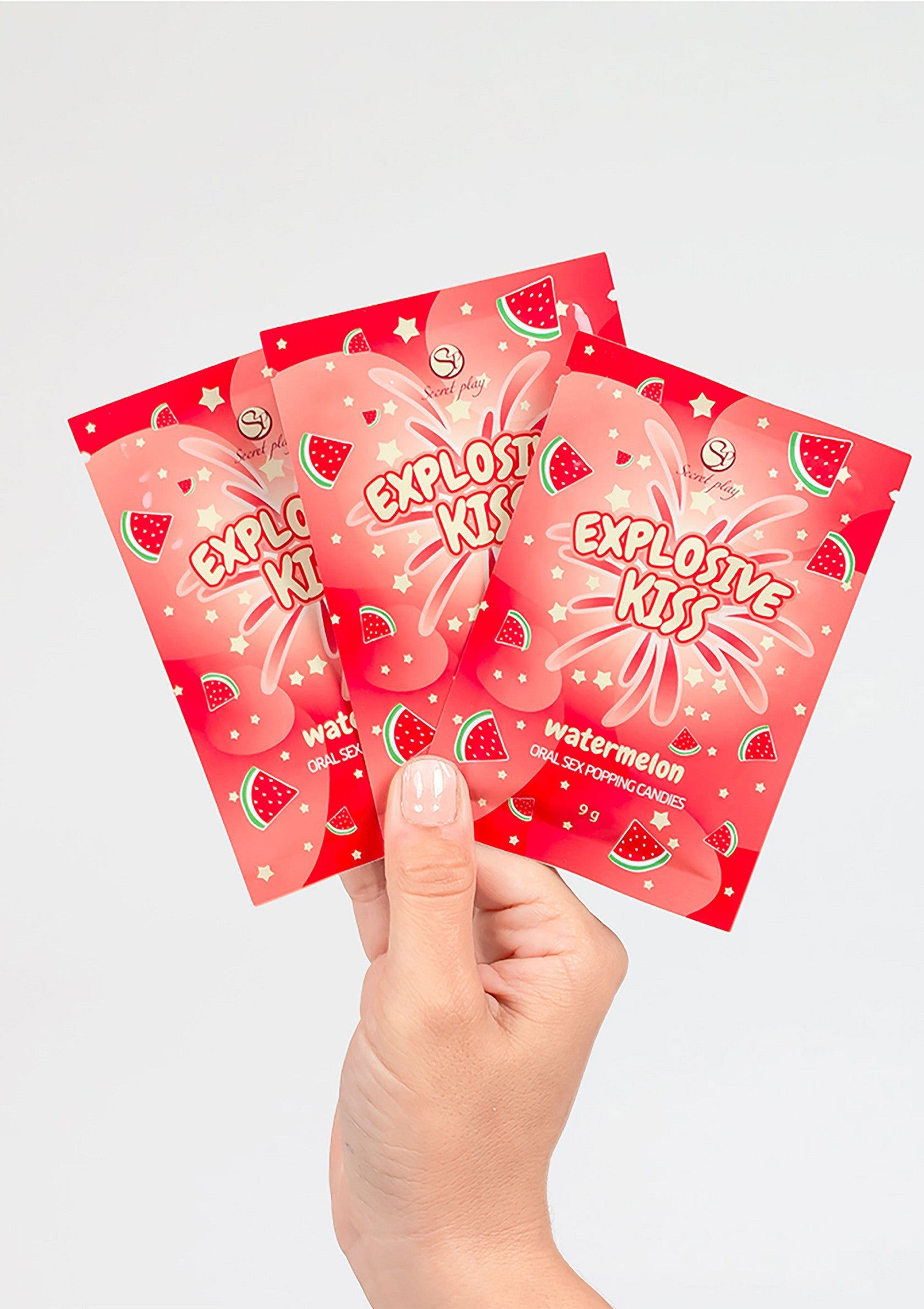 Bonbons pétillants aromatisés à la pastèque Explosive Kiss pour des jeux coquins !; Explosive Kiss watermeloen knettersnoepjes voor ondeugende spelletjes!; Explosive Kiss watermelon flavored popping candies for playful fun!