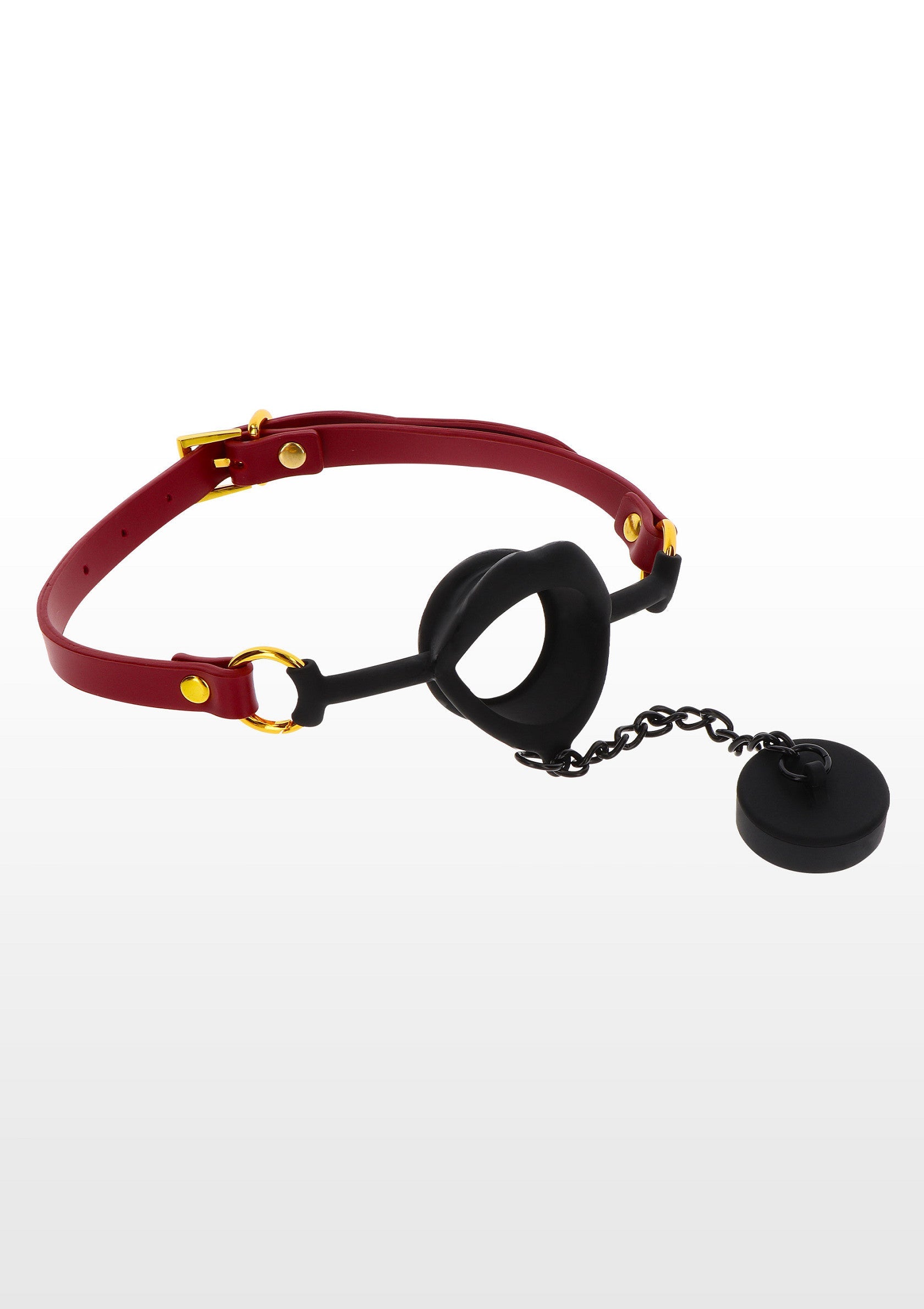 Bâillon à anneau avec bride rouge et bouchon en silicone noir pour le jeu de rôle adulte.; Ringknevel met rode band en zwarte siliconen plug voor rollenspellen voor volwassenen.; Ring gag with red strap & black silicone plug for adult roleplay fun.