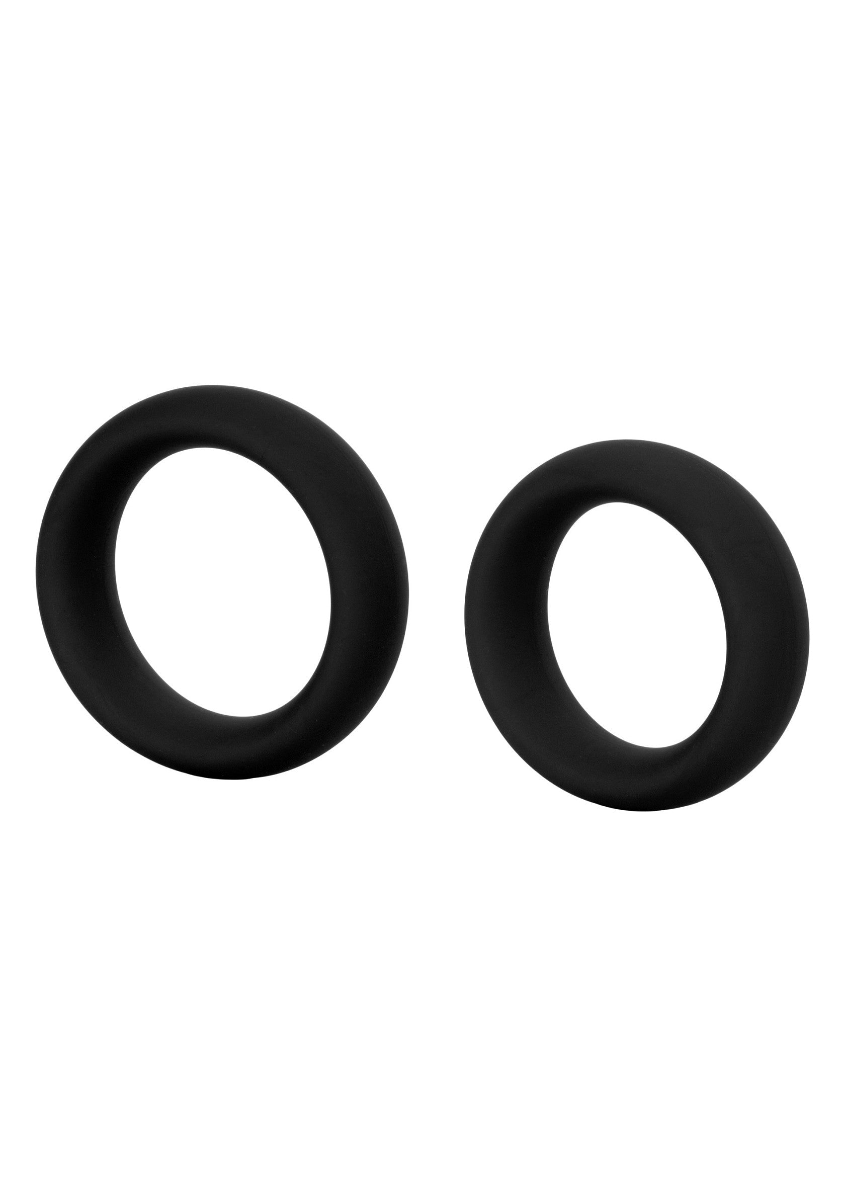 Ensemble d'anneaux péniens noirs en silicone souple pour un plaisir accru.; Set zwarte penisringen van zachte siliconen voor meer plezier.; Set of black penis rings made of soft silicone for enhanced pleasure.