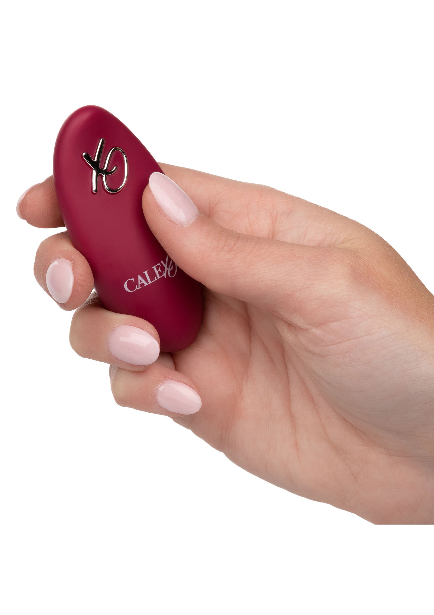 Vibromasseur Calex XO Mini rose dans une main, idéal pour des plaisirs intimes et discrets.; Calex XO Mini roze vibrator in hand, ideaal voor intiem en discreet plezier.; Pink Calex XO Mini vibrator held in hand, ideal for discreet and intimate pleasure.