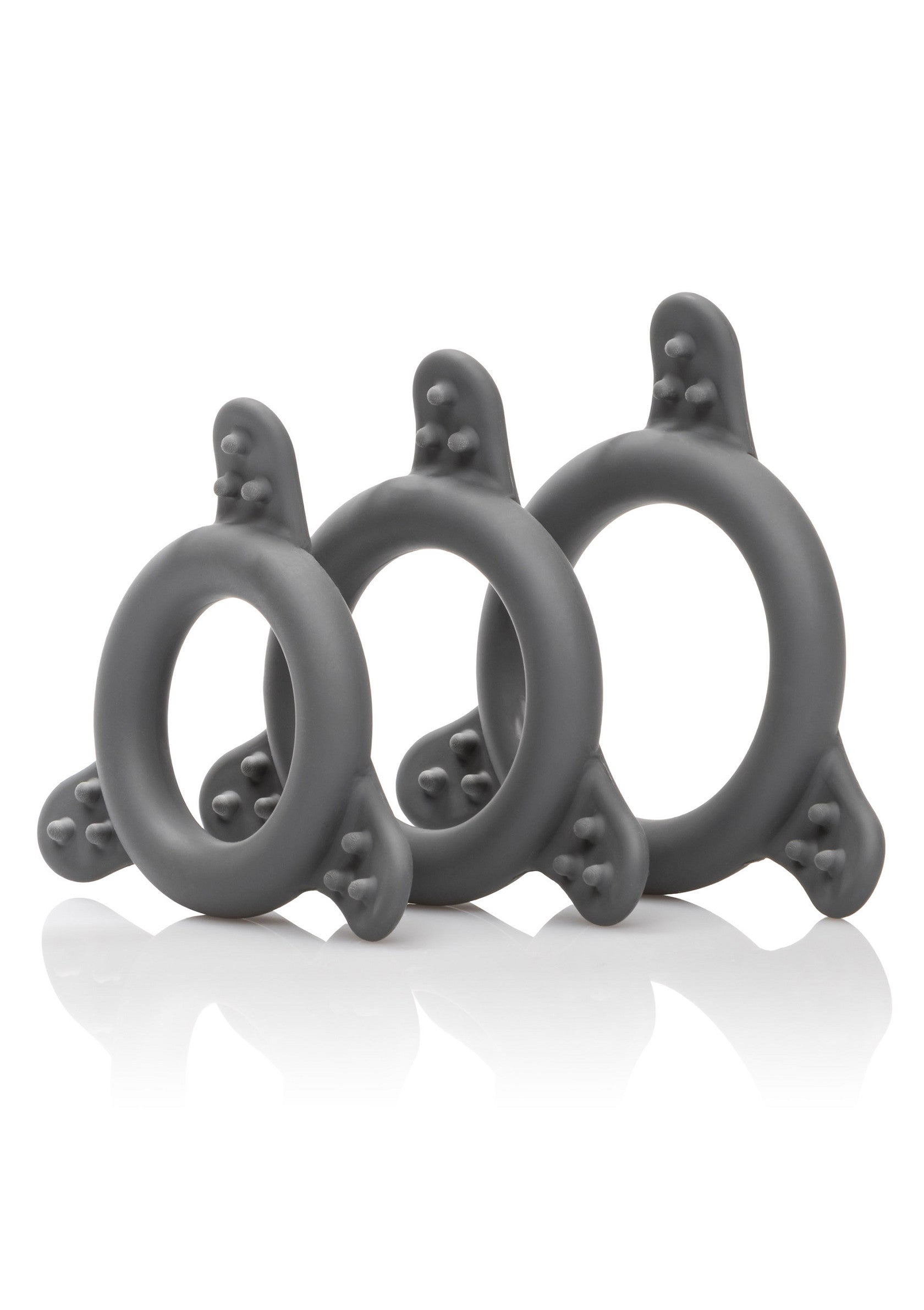 Ensemble de trois anneaux péniens texturés gris pour une stimulation accrue.; Set van drie grijze, getextureerde penisringen voor extra stimulatie.; Set of three gray textured cock rings for enhanced stimulation.