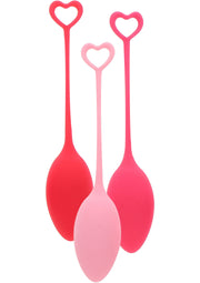 Oeufs de Yoni roses et rouges avec poignées en forme de coeur, accessoires pour le bien-être intime.; Roze en rode Yoni eieren met hartvormige handvatten, accessoires voor intiem welzijn.; Pink and red Yoni eggs with heart-shaped handles, accessories for intimate wellbeing.