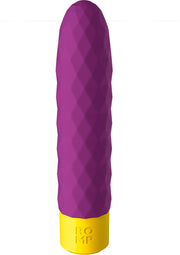 Vibromasseur violet avec base jaune pour le plaisir.; Paarse vibrator met gele basis voor plezier.; Purple vibrator with a yellow base for pleasure.