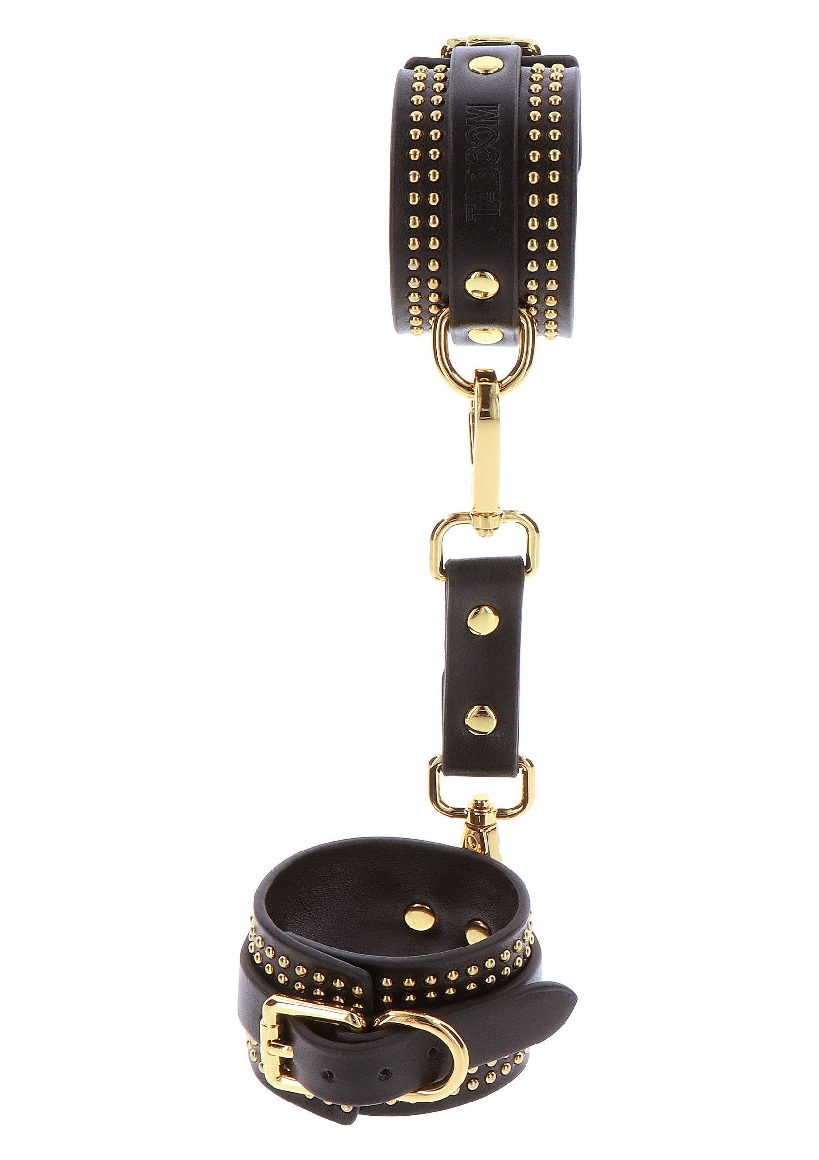 Menottes en cuir noir cloutées d'or. Accessoires de mode audacieux et élégants pour une touche de style unique.; Zwarte lederen handboeien met gouden studs. Gedurfde en stijlvolle modeaccessoires voor een unieke stijl.; Black leather handcuffs with gold studs. Edgy and stylish fashion accessories for a unique style statement.