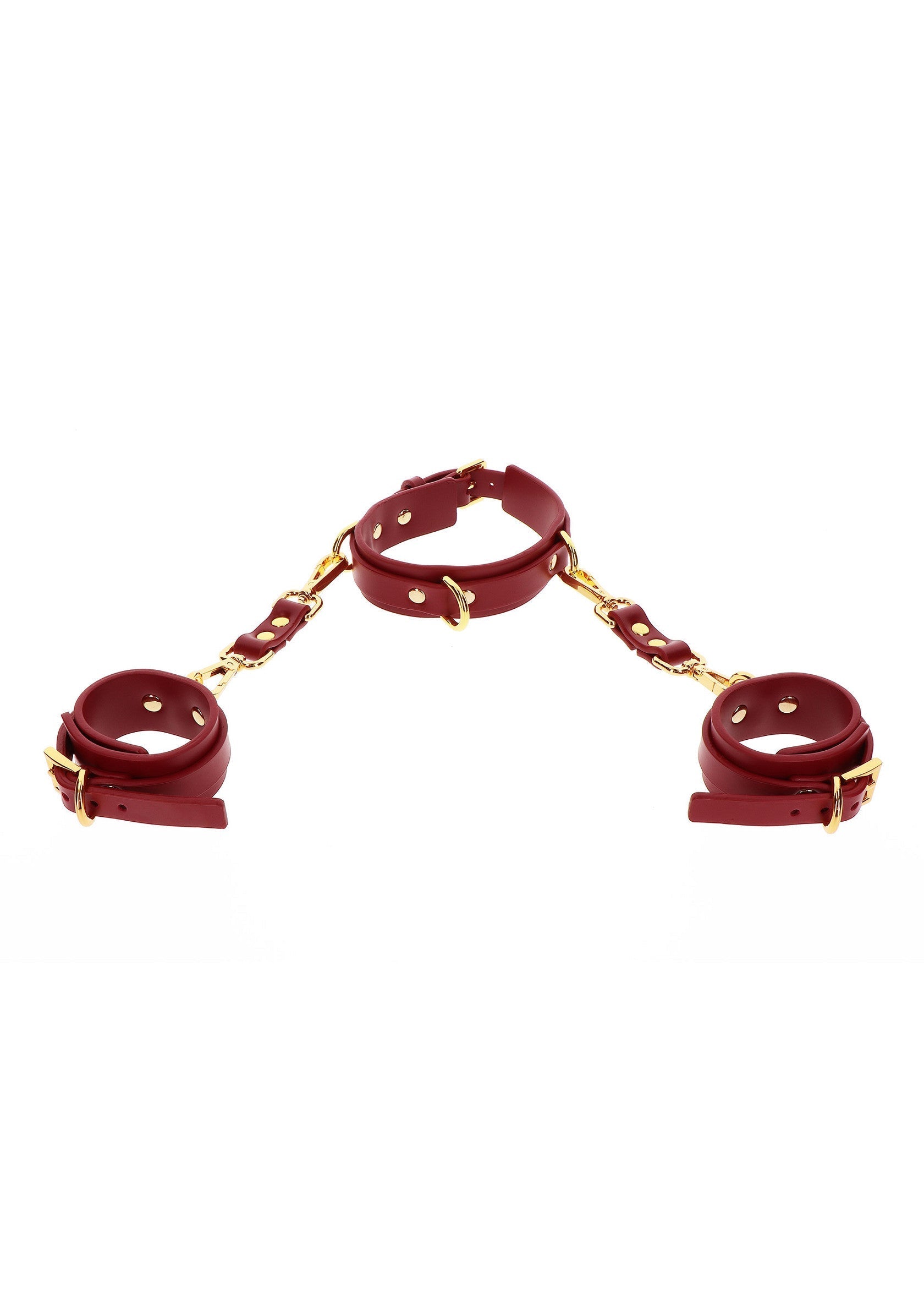 Ensemble de contention en cuir rouge, avec menottes et collier reliés par une chaîne dorée.; Rode lederen bondage set met handboeien en halsband verbonden door een gouden ketting.; Red leather bondage set, with handcuffs and collar connected by a golden chain.