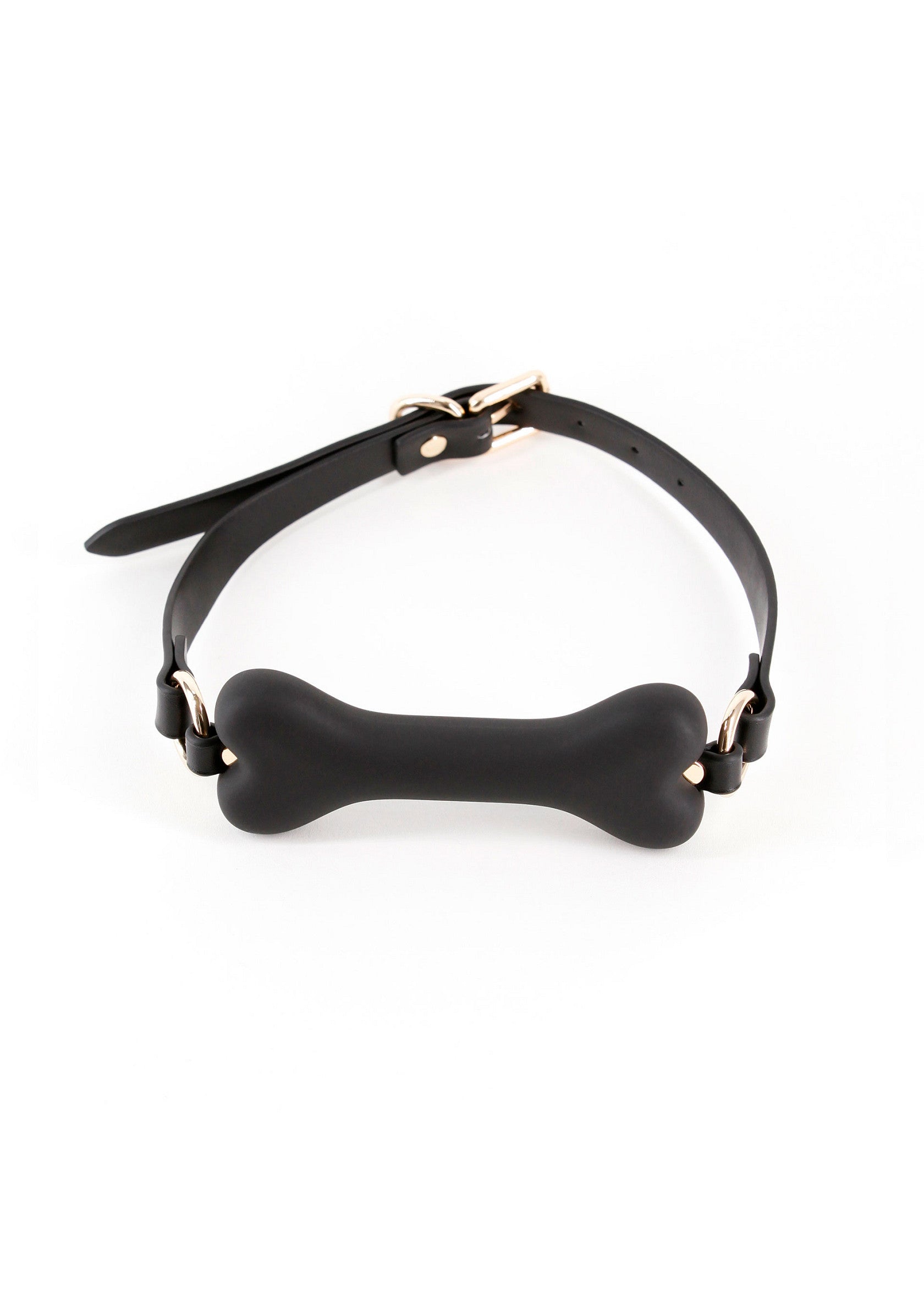 Gag bâillon en forme d'os avec sangle noire réglable.; Knevel in botvorm met verstelbare zwarte band.; Bone-shaped gag with adjustable black strap.
