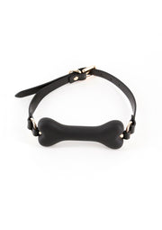 Gag bâillon en forme d'os avec sangle noire réglable.; Knevel in botvorm met verstelbare zwarte band.; Bone-shaped gag with adjustable black strap.
