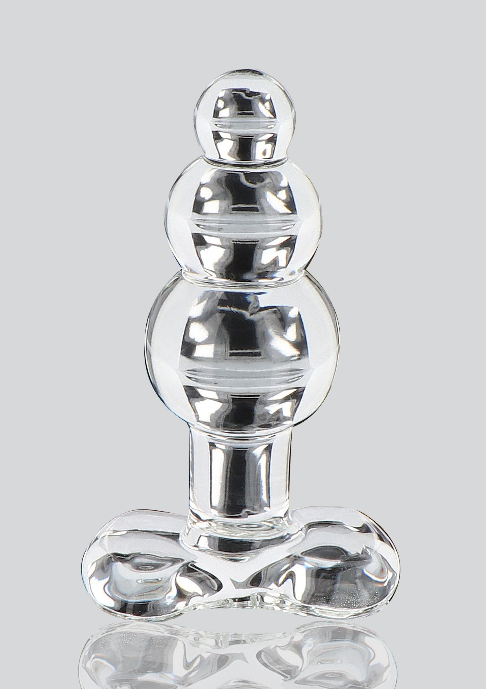 Plug anal en verre transparent à 3 boules pour un plaisir intense et élégant.; Transparante glazen anale plug met 3 bollen voor intens en elegant plezier.; Clear glass anal plug with 3 beads for intense and elegant pleasure.