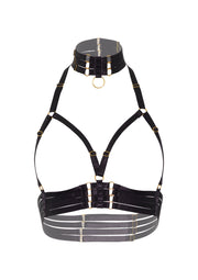 Harnais de lingerie noir avec des détails dorés.; Zwart lingerie harnas met gouden details.; Black lingerie harness with gold details.