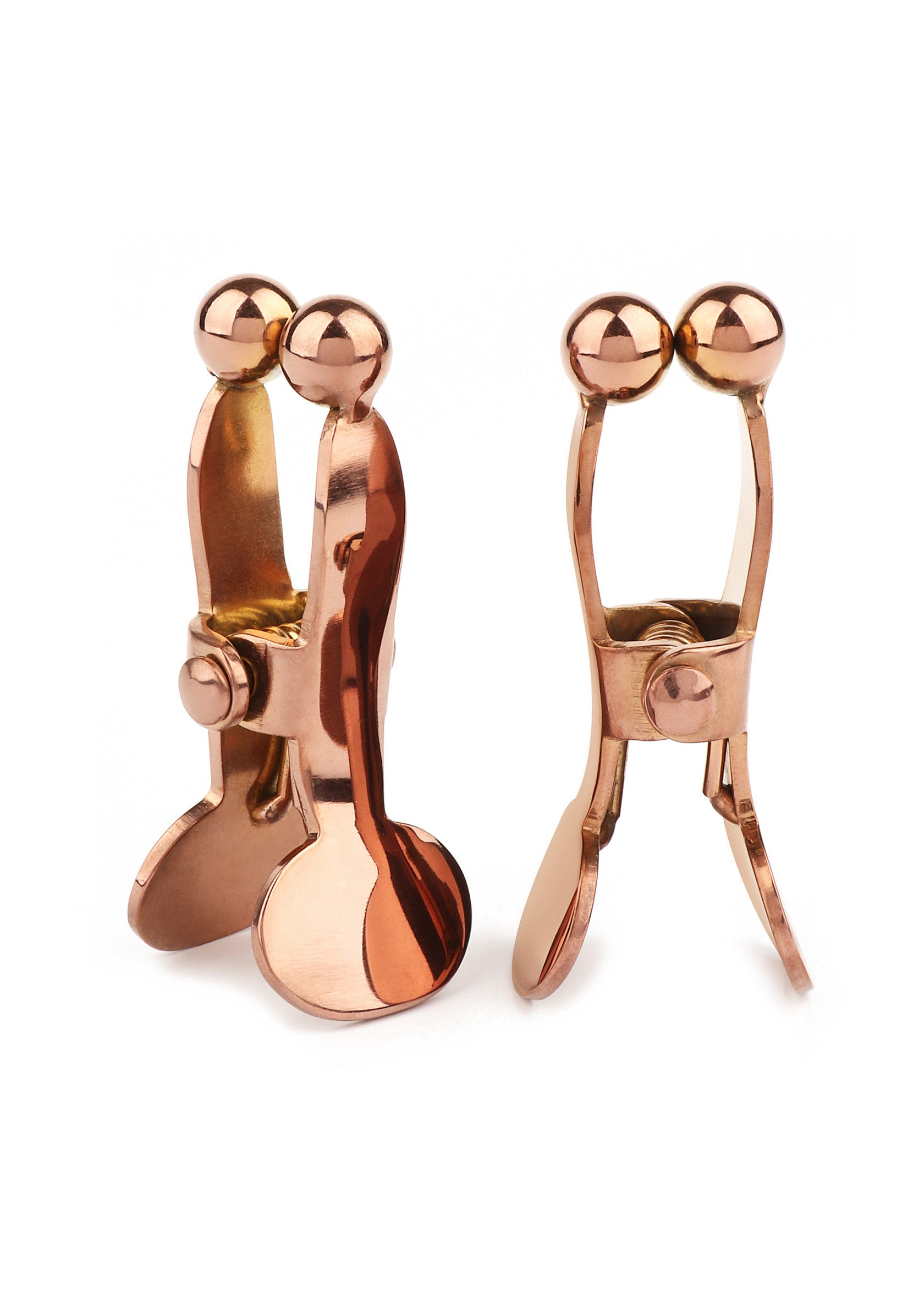 Pinces à linge décoratives en cuivre. Accessoires de design pour la maison et le bureau.; Decoratieve koperen wasknijpers. Design accessoires voor thuis en op kantoor.; Decorative copper clothespins. Design accessories for home and office.