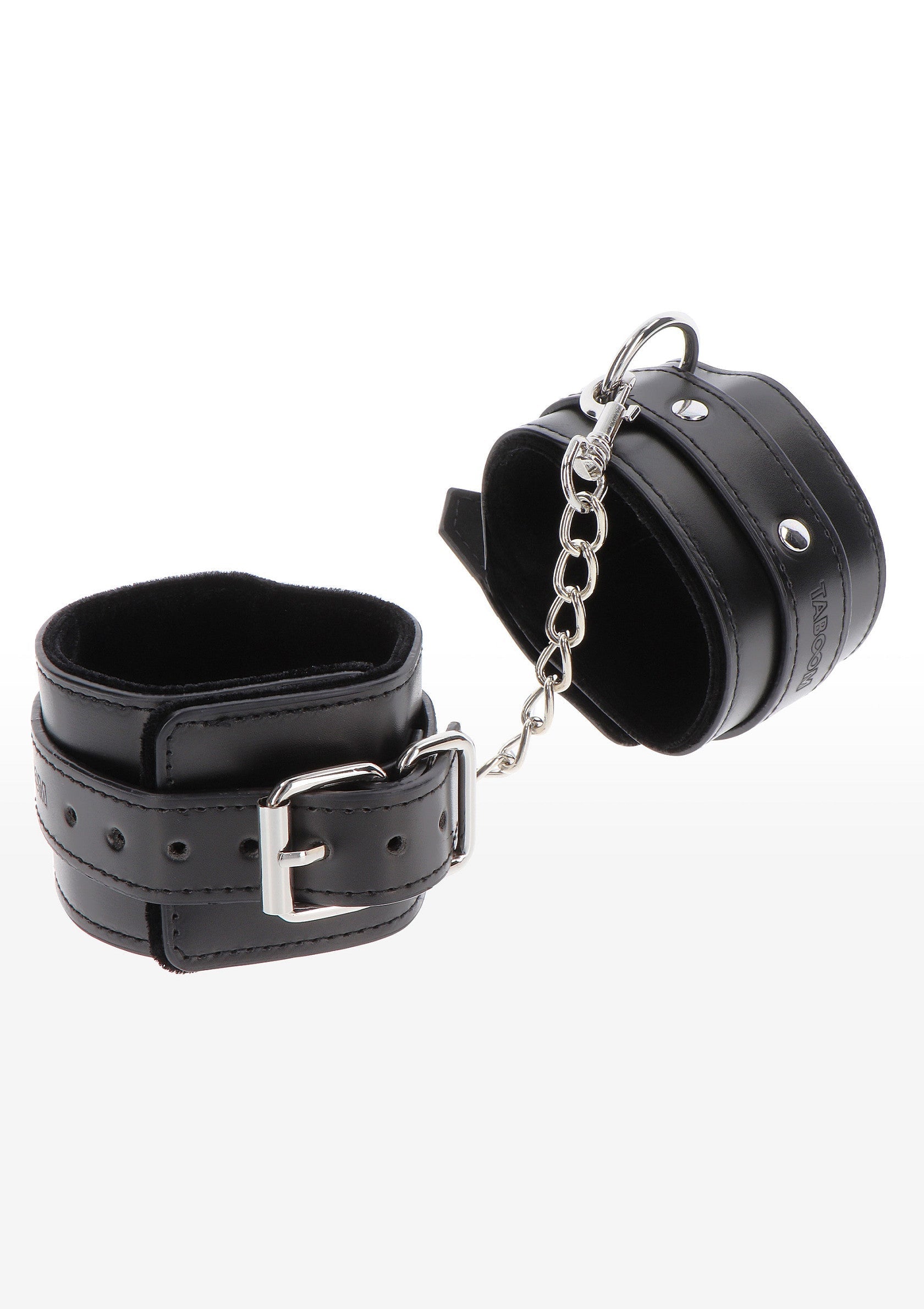 Manchettes en cuir noir avec chaîne. Accessoires coquins pour pimenter vos jeux érotiques.; Zwarte leren handboeien met ketting. Sexy accessoires om je erotische spelletjes mee op te leuken.; Black leather handcuffs with chain. Kinky accessories to spice up your erotic games.