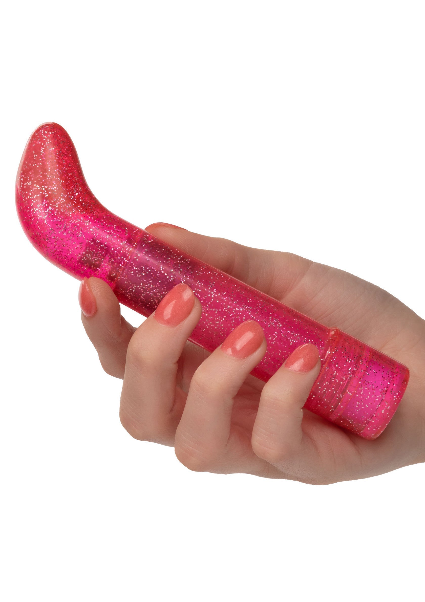 Vibromasseur rose pailleté tenu à la main. Plaisir garanti avec ce jouet intime vibrant et glamour.; Roze glitter vibrator in de hand. Gegarandeerd plezier met dit vibrerende en glamoureuze intieme speeltje.; Pink glitter vibrator being held. Guaranteed pleasure with this vibrating and glamorous intimate toy.