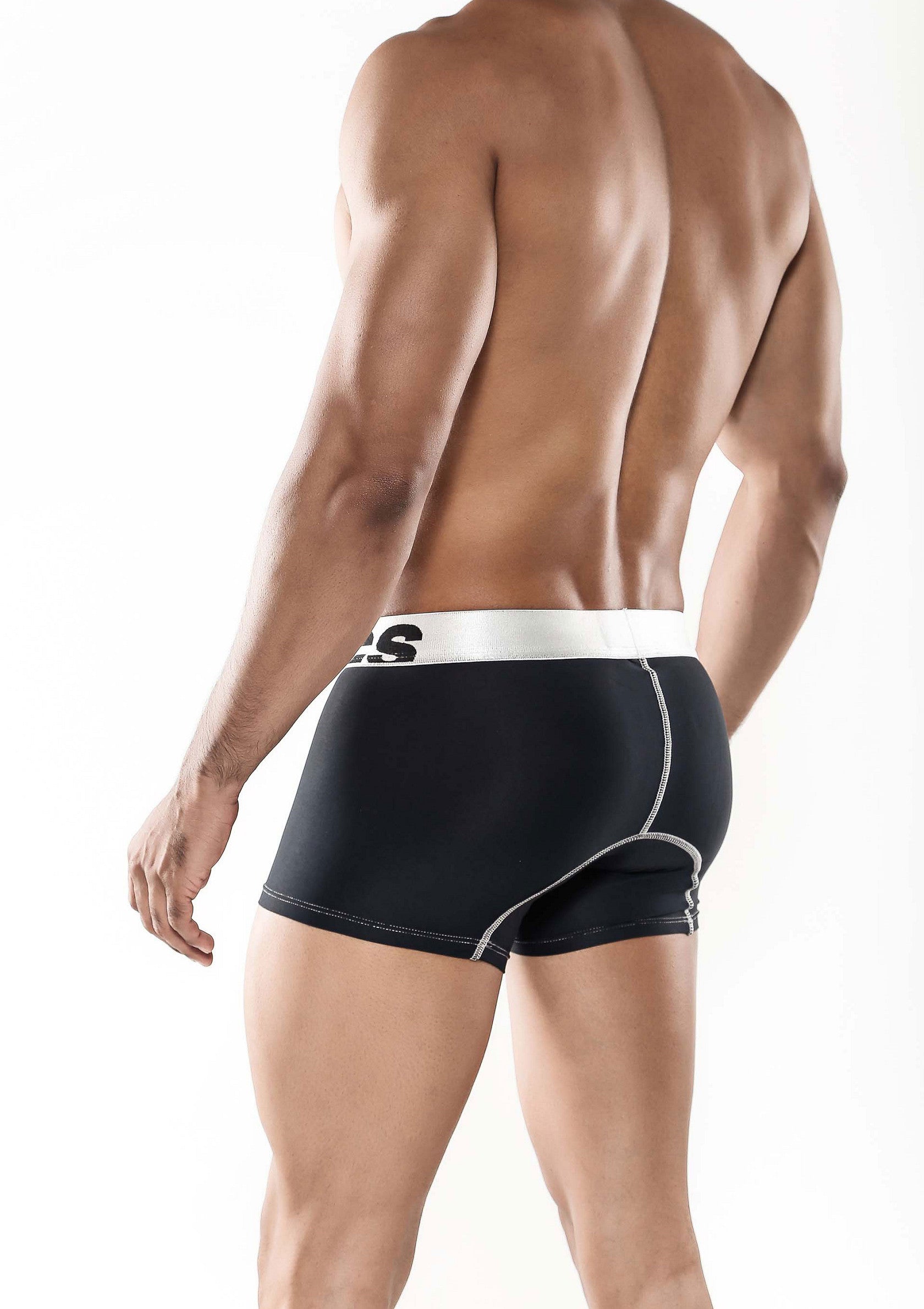 Boxer noir pour homme avec ceinture blanche. Confort et style assurés. Parfait pour l'entraînement ou le quotidien.; Zwarte herenboxer met witte tailleband. Comfort en stijl gegarandeerd. Perfect voor training of dagelijks gebruik.; Black men's boxer briefs with white waistband. Comfort and style guaranteed. Perfect for workout or everyday wear.