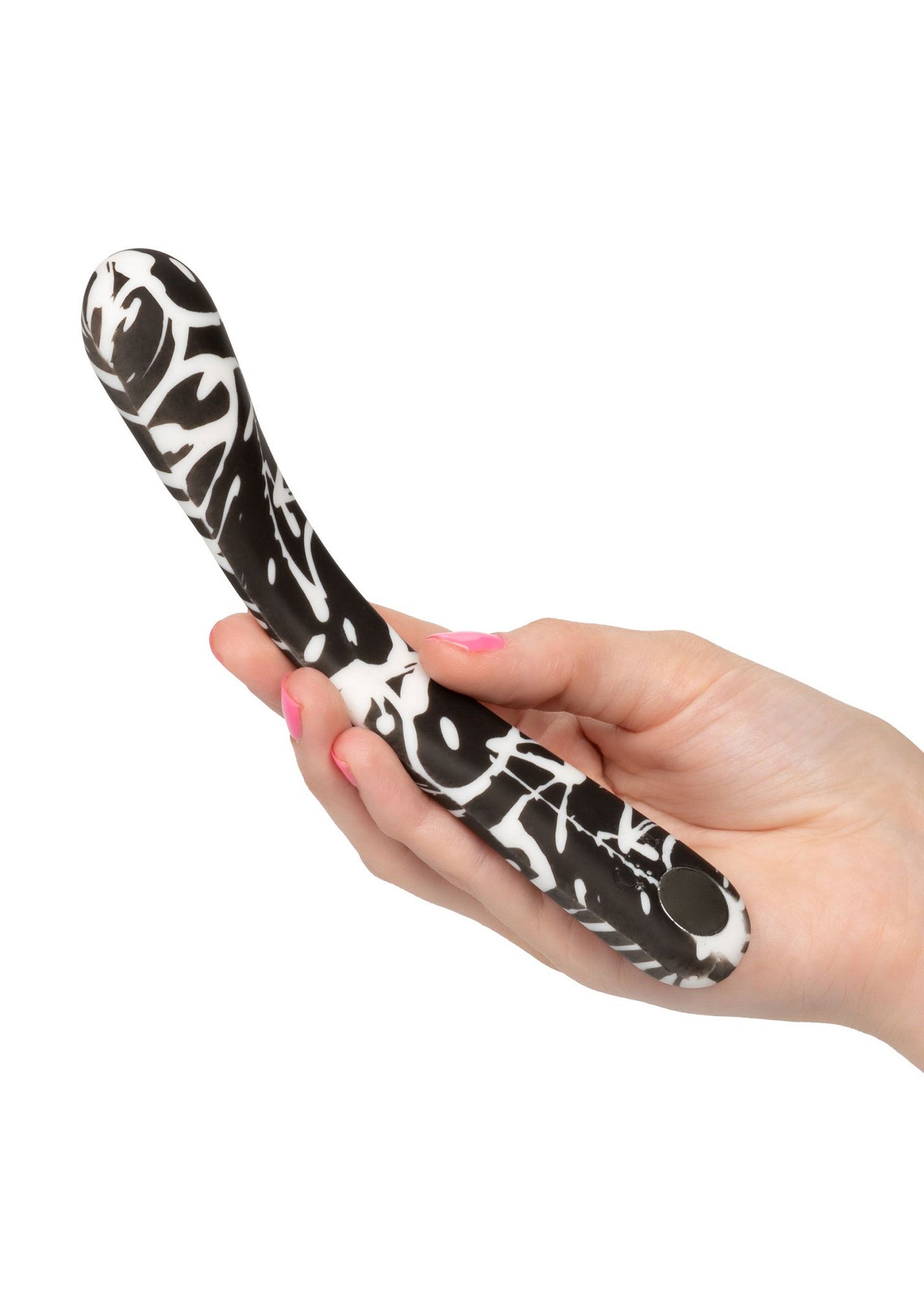 Vibrateur noir et blanc à motifs pour le plaisir intime, présenté dans la main d'une femme.; Zwart-witte vibrator met patroon voor intiem plezier, gepresenteerd in de hand van een vrouw.; Black and white patterned vibrator for intimate pleasure, presented in a woman's hand.