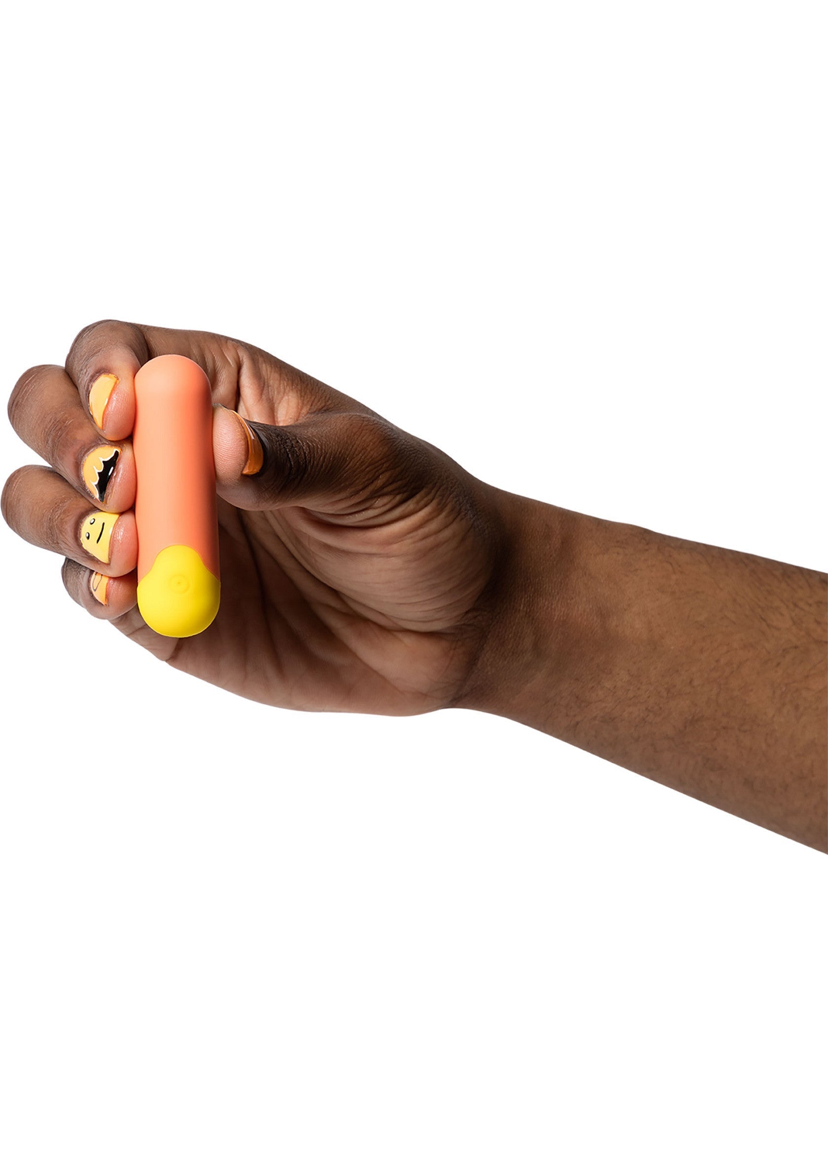 Main tenant un vibromasseur rose et jaune pour le plaisir personnel.; Hand die een roze en gele vibrator vasthoudt voor persoonlijk genot.; Hand holding a pink and yellow vibrator for personal pleasure.