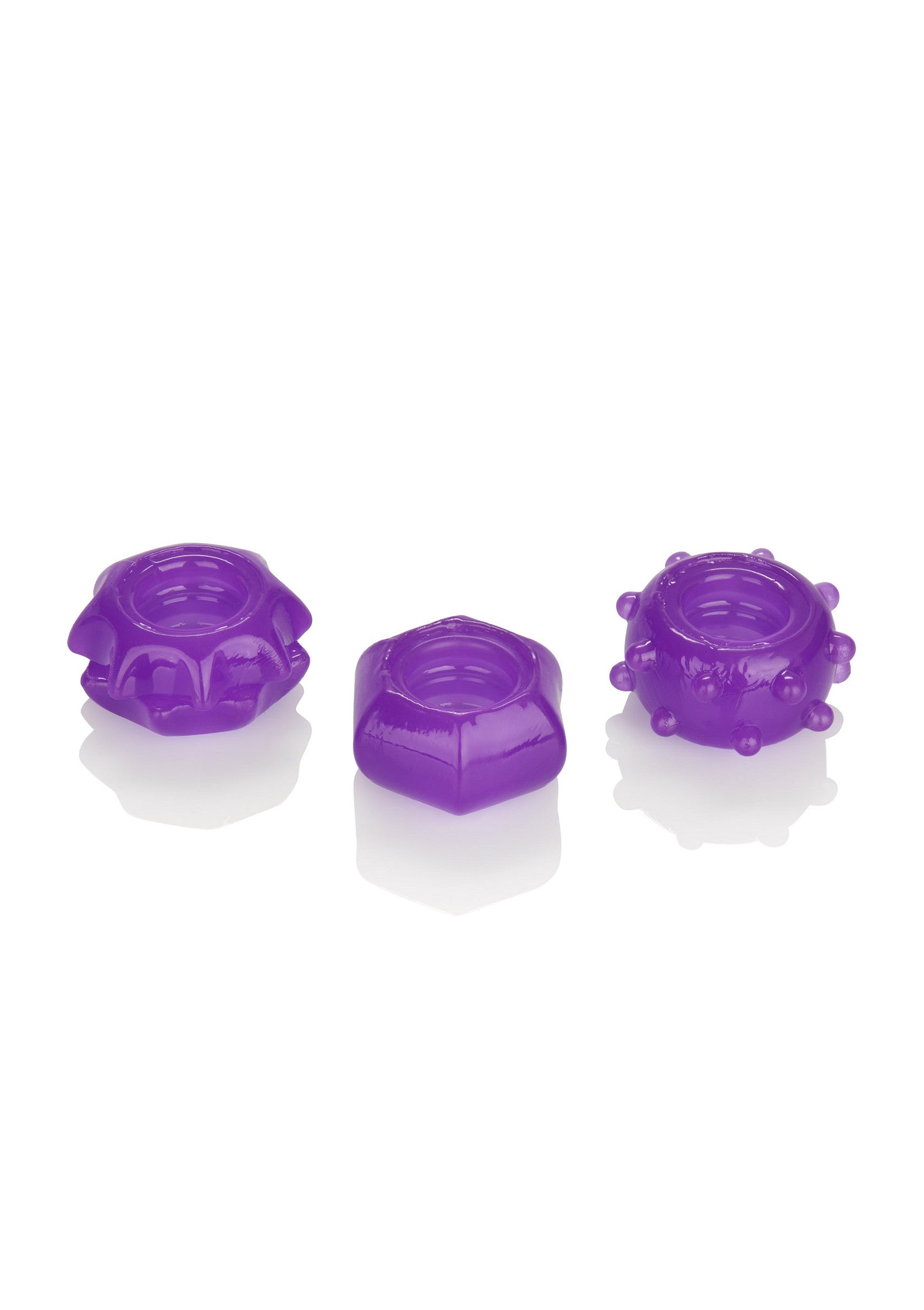 Ensemble de 3 anneaux péniens violets texturés pour plus de plaisir.; Set van 3 paarse getextureerde penisringen voor extra genot.; Set of 3 textured purple cock rings for extra pleasure.
