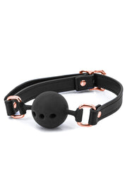 Bâillon de bouche noir élégant avec détails or rose. Accessoire de soumission discret et luxueux.; Elegante zwarte mondknevel met roségouden details. Discrete en luxe submission accessoire.; Elegant black ball gag with rose gold details. Discreet and luxurious submission accessory.