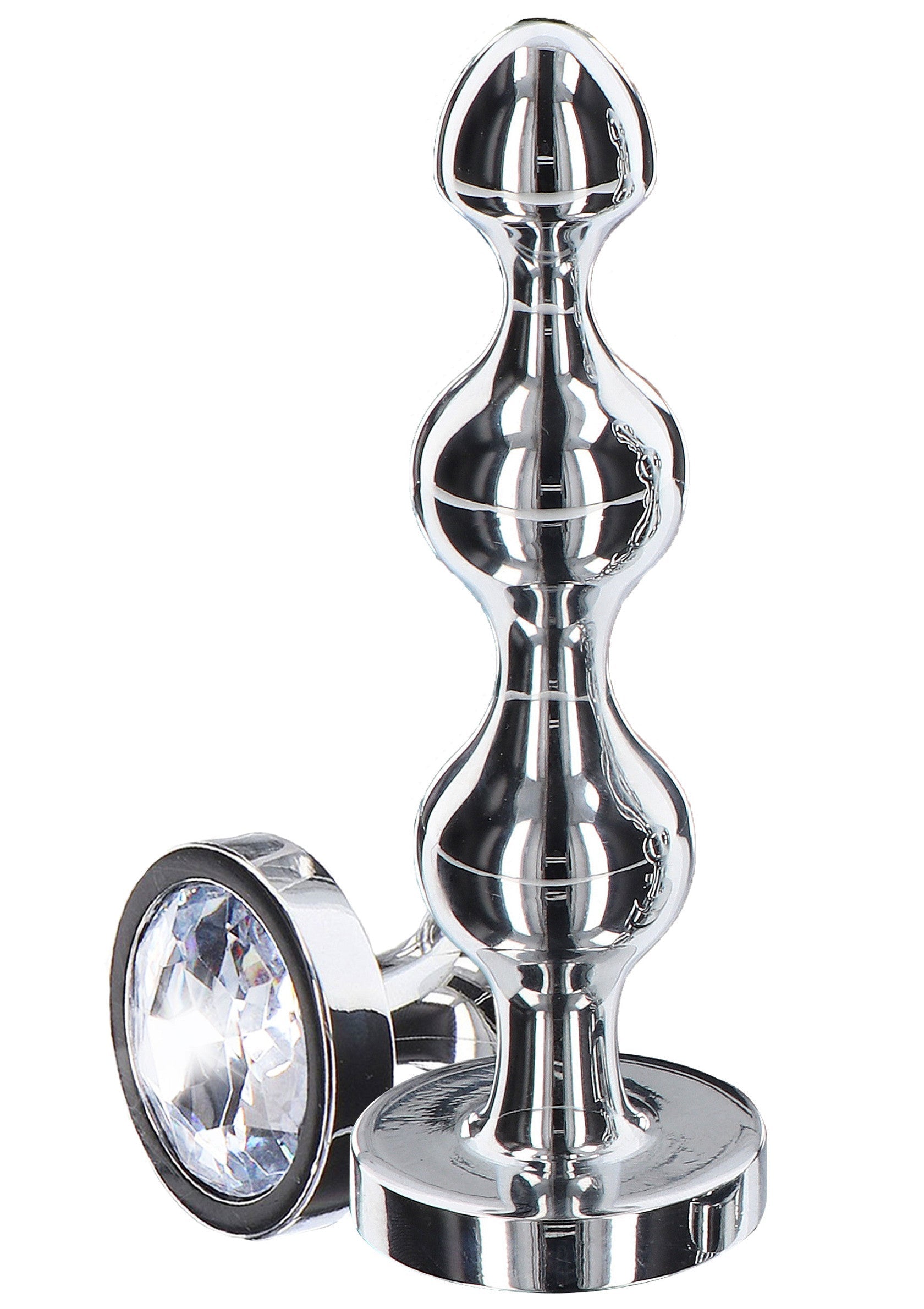 Plug anal en métal brillant avec cristal taillé. Plaisir anal sophistiqué et lumineux.; Gepolijste metalen anale plug met geslepen kristal. Verfijnd en sprankelend anaal plezier.; Polished metal butt plug with cut crystal accent. Refined and sparkling anal pleasure.