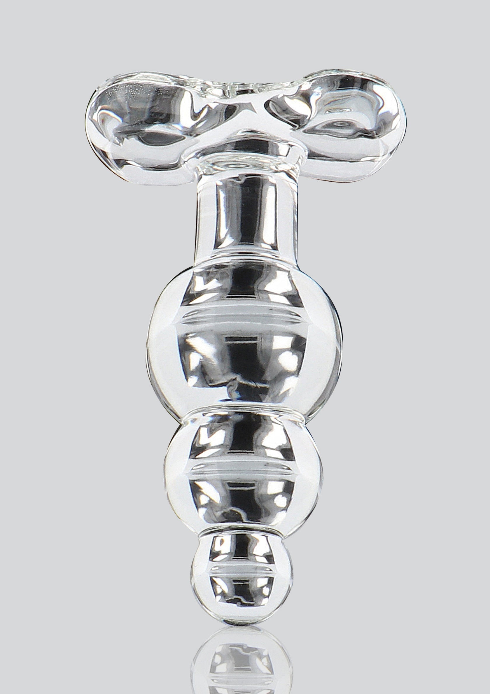 Plug anal en verre transparent, forme unique et élégante pour le plaisir intime.; Transparante glazen anale plug, unieke en elegante vorm voor intiem plezier.; Clear glass anal plug, unique and elegant shape for intimate pleasure.