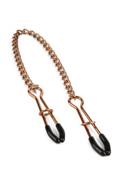 Pinces à tétons en métal avec chaîne pour jeux coquins.; Metalen tepelklemmen met ketting voor pikante spelletjes.; Metal nipple clamps with chain for kinky play.