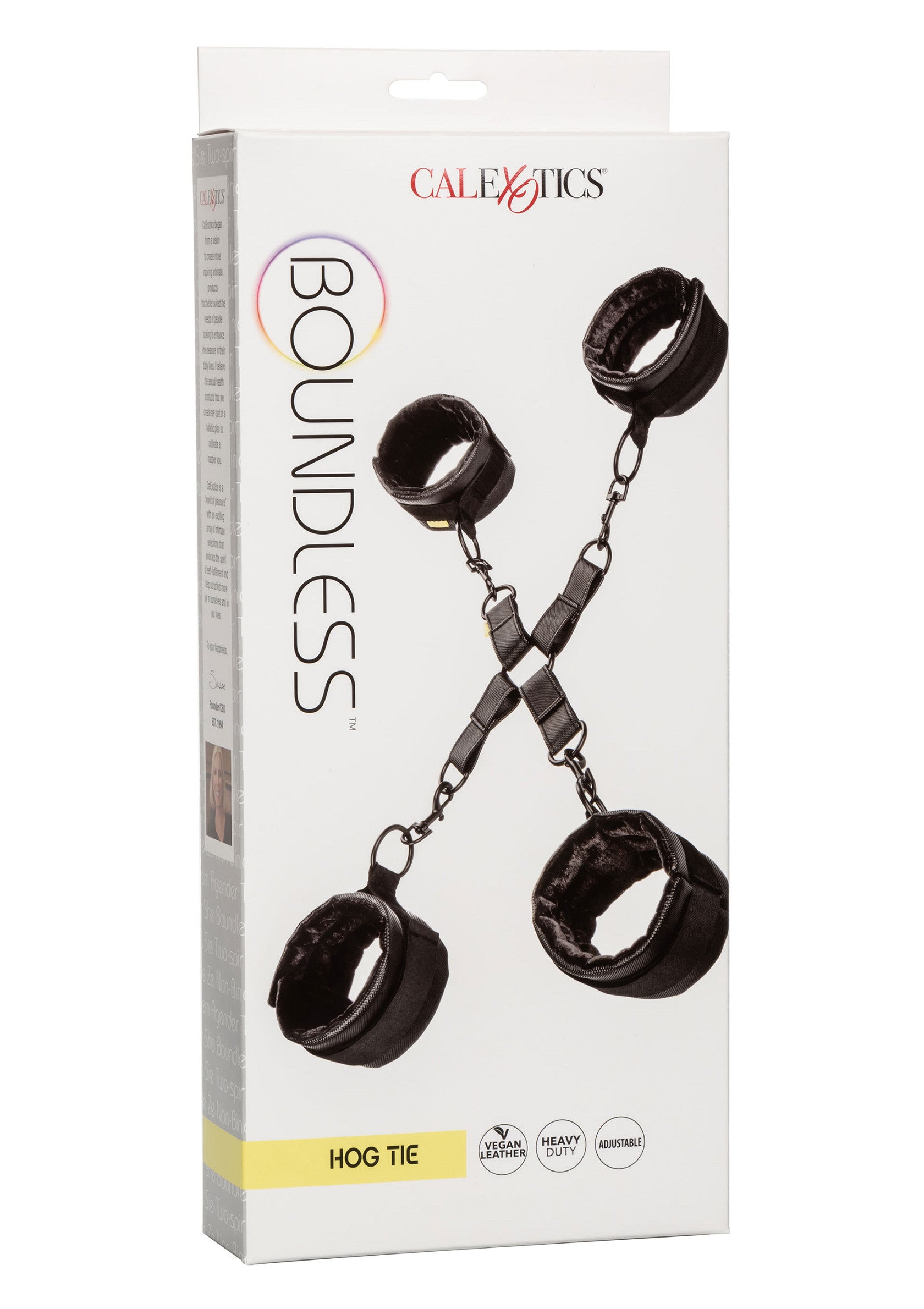 Menottes Boundless Hog Tie CalExotics. Accessoire de jeux coquins, en simili cuir vegan, résistantes et réglables.; Boundless Hog Tie handboeien van CalExotics. Zwarte vegan lederlook, stevig en verstelbaar voor een spannend erotisch spel.; CalExotics Boundless Hog Tie. Vegan leather bondage restraints, heavy-duty, and adjustable for ultimate erotic play.