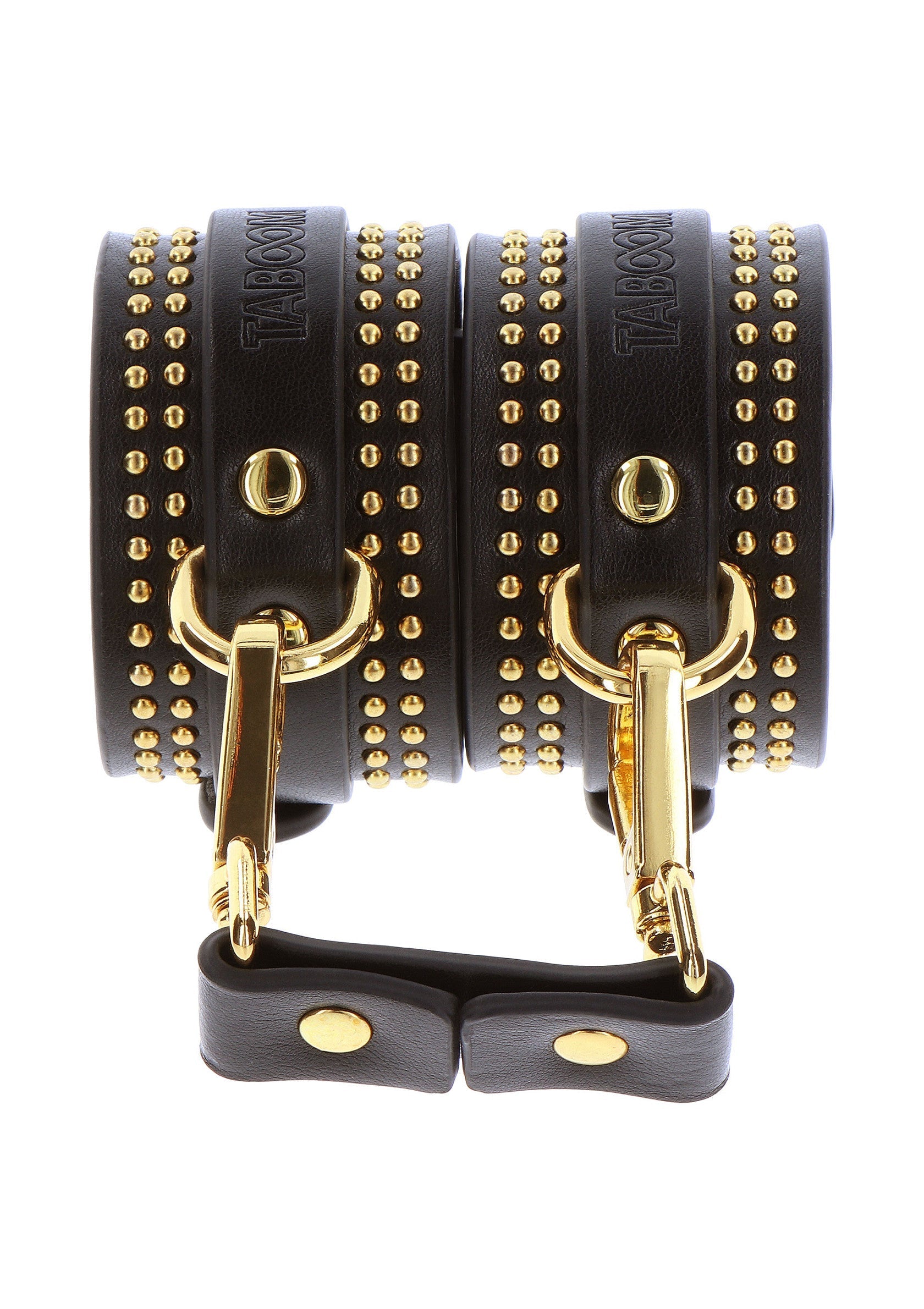 Menottes en cuir noir cloutées avec boucles dorées.; Zwarte leren handboeien met gouden studs en sluitingen.; Black leather cuffs studded with gold hardware.